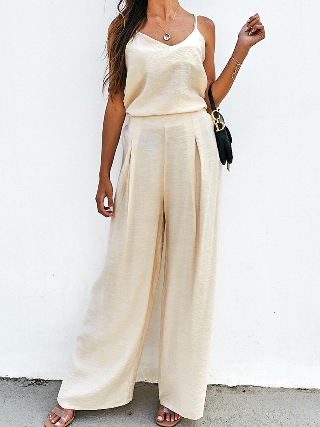 a woman standing in front of a white wall