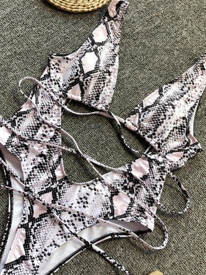 a woman's bralet laying on the ground next to a basket