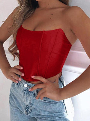 a woman wearing a red top and jeans
