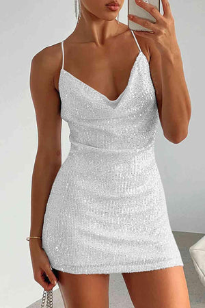 a woman taking a selfie in a white dress