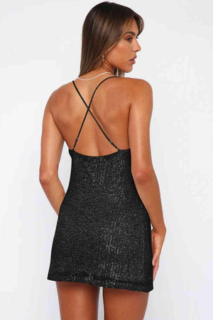 a woman in a short black dress