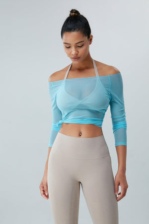 a woman wearing a crop top and leggings