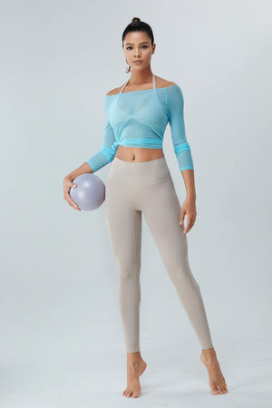a woman is holding a ball and posing for a picture