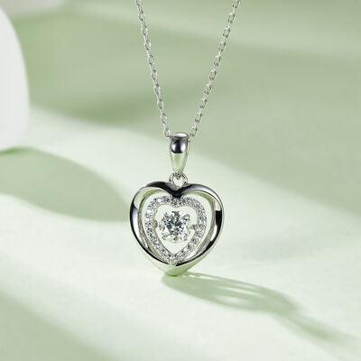 a heart shaped diamond pendant on a chain