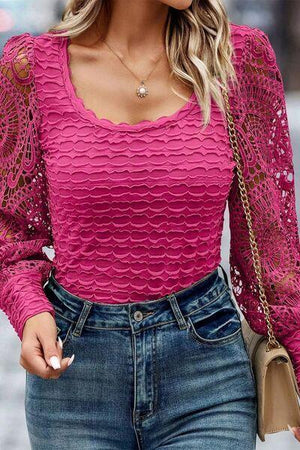 a woman wearing a pink top and jeans