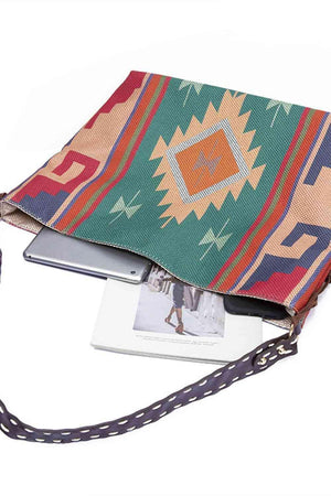 a purse with a book on the bottom of it