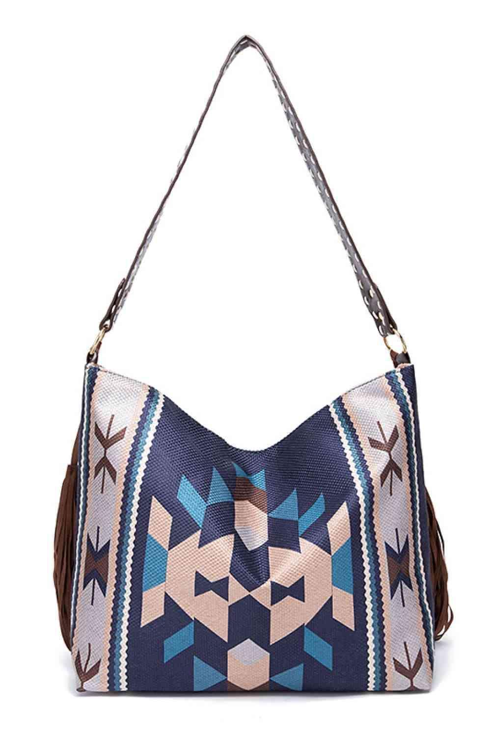 a blue and white bag with a brown handle