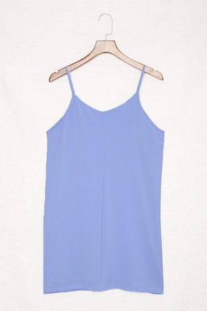 a blue top hanging on a wooden hanger