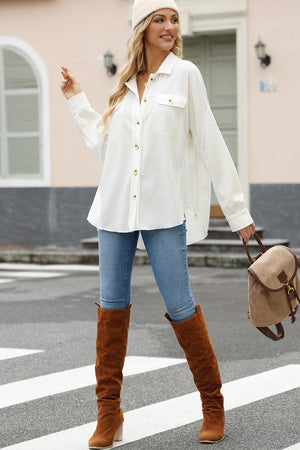 a woman in a white shirt and brown boots