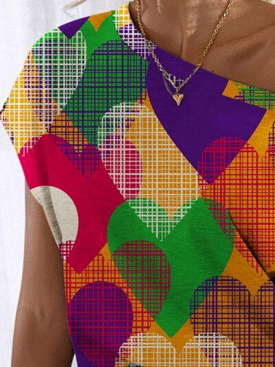 a woman wearing a multicolored dress and a necklace