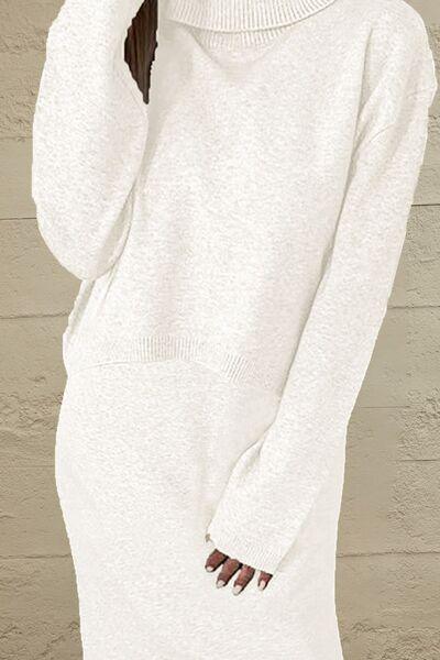 a woman wearing a white sweater dress with a ponytail