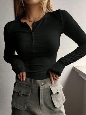 a woman wearing a black shirt and a skirt