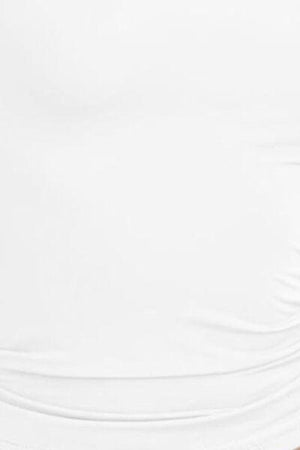 a woman in a white top is holding a tennis racket