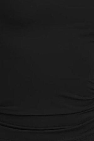 a woman wearing a black top with a black belt