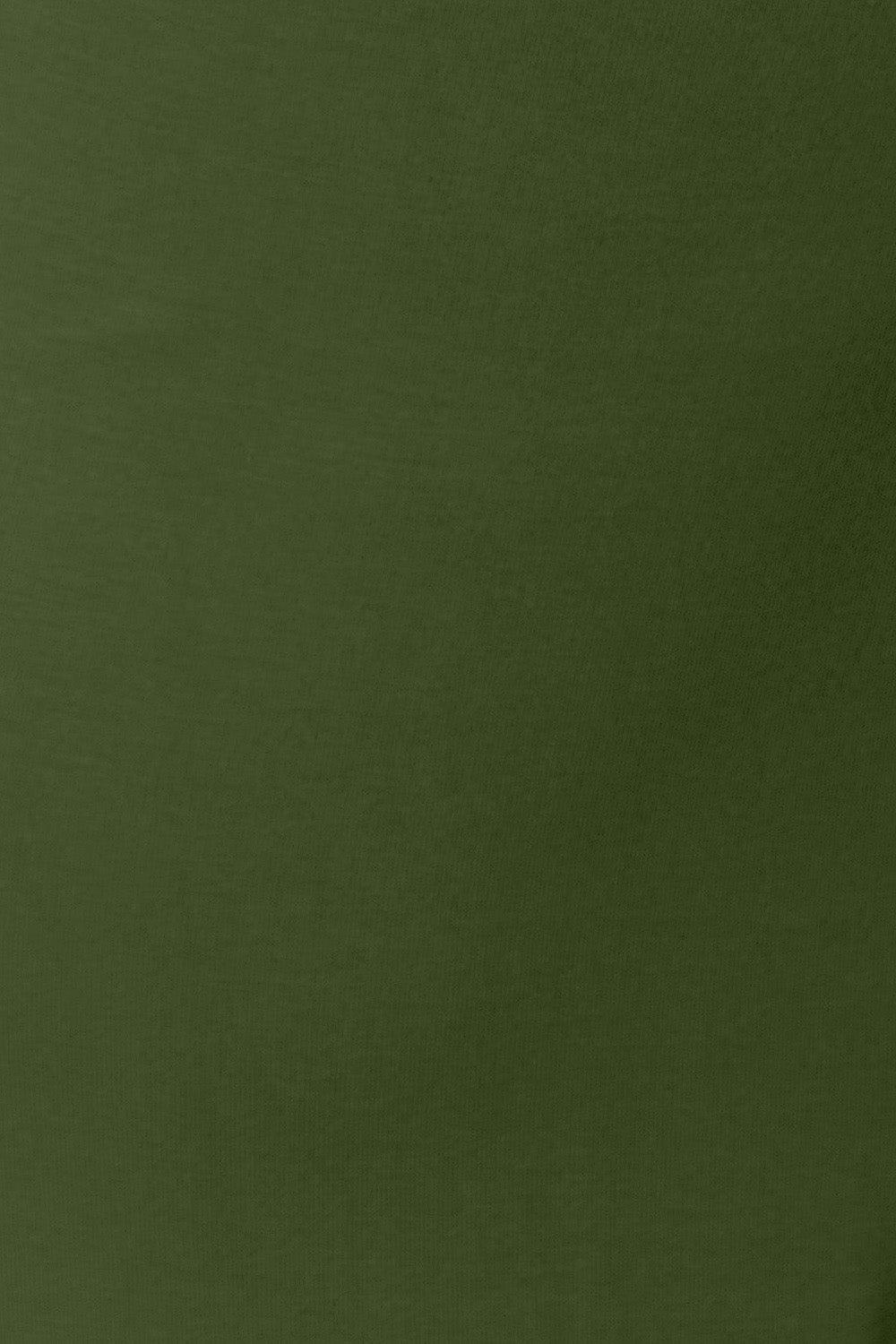 a man in a green shirt is holding a cell phone