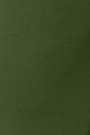 a man in a green shirt is holding a cell phone