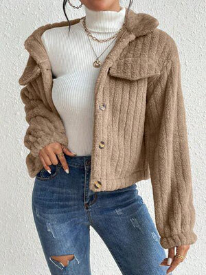 a woman wearing a white turtle neck sweater and ripped jeans