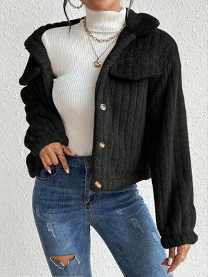 a woman wearing a black jacket and jeans