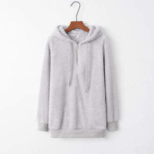 a white sweatshirt with a hoodie on a hanger