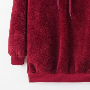 a red sweatshirt with a hoodie on top of it