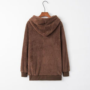 a brown jacket hanging on a hanger