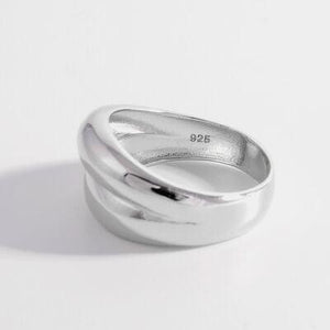 a close up of a ring on a white surface