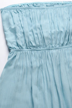 a close up of a dress on a white surface