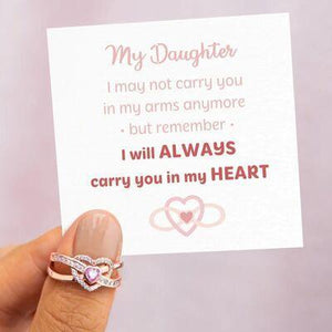 a person holding a card with a heart on it