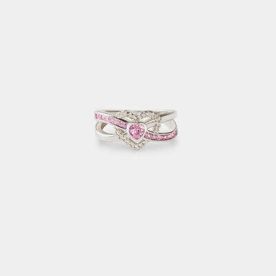 a white gold ring with pink and white diamonds