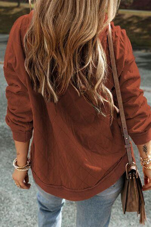 a woman walking down a street with a handbag