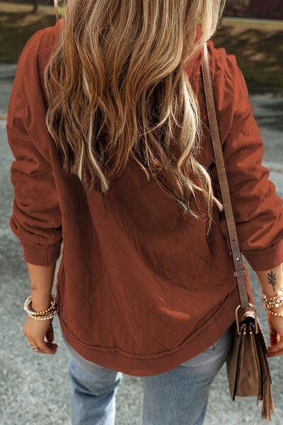 a woman walking down a street with a handbag