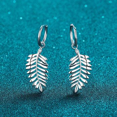 a pair of silver earrings on a blue background