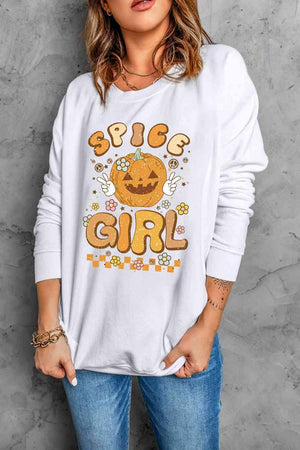 a woman wearing a white shirt with a pumpkin on it