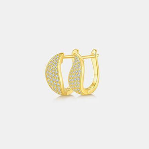 a pair of yellow gold hoop earrings with diamonds