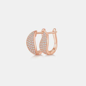 a rose gold ring with white diamonds