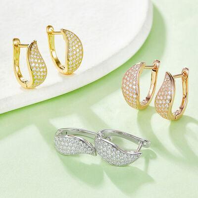 three pairs of gold and silver hoop earrings