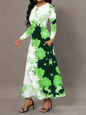 a woman wearing a green and white floral print dress
