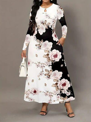 a woman in a black and white floral print dress