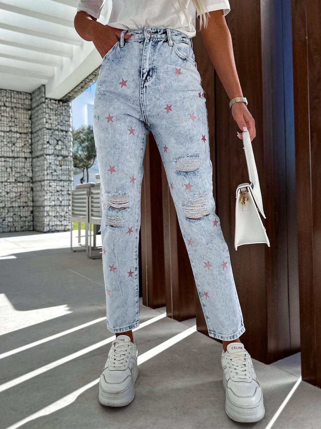 a woman in white shirt and jeans holding a handbag