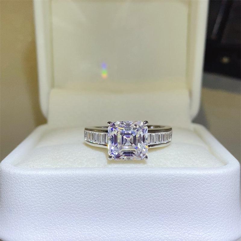 a ring with a princess cut diamond in a box