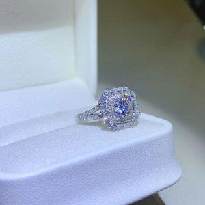a diamond ring sitting on top of a white box