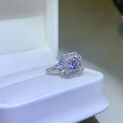a diamond ring sitting on top of a white box
