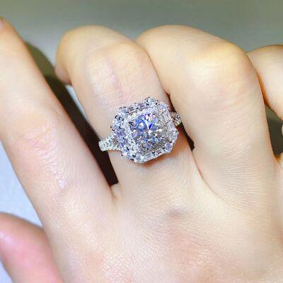 a close up of a person's hand with a ring on it