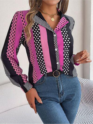 a woman wearing a pink and black shirt and jeans