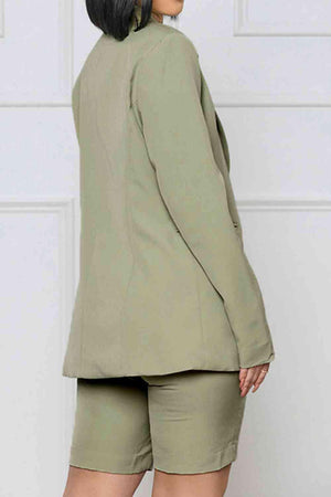 a woman wearing a green blazer and shorts