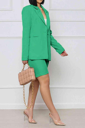 a woman in a green suit and heels