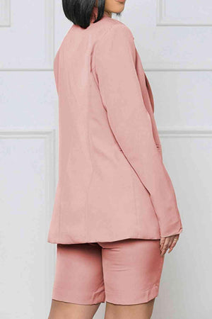 a woman wearing a pink blazer and shorts