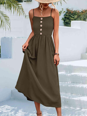 a woman wearing a brown dress and a straw hat