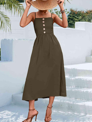 a woman wearing a brown dress and a straw hat