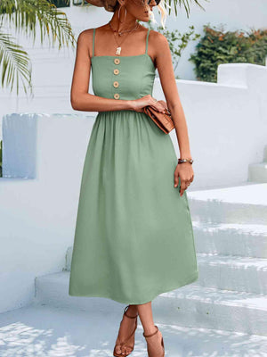 a woman wearing a green dress and hat